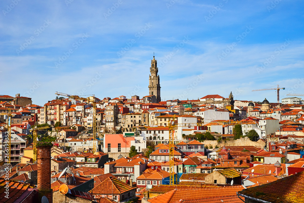 Stunning panoramic aerial view of traditional historic buildings in Porto. Vintage houses with red tile roofs. Famous touristic place and travel destination in  Portugal