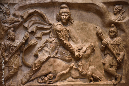 Marble relief carving of the God Mithras slaying the mystic bull second century Rome at ROM Toronto photo