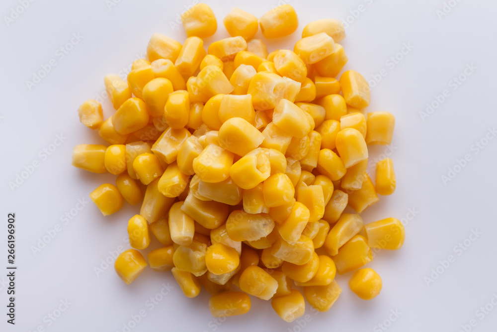 Canned corn on a white acrylic background