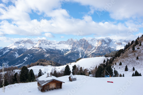 A wooden cottage with panorama of Dolomiti, Canazei, Italy © Oldrich