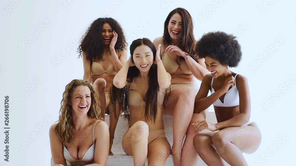 Group of multi ethnic women with different kind of beauty and body, posing and having fun in a studio Group of multi ethnic women with different kind of beauty and body, posing and having fun in a studio