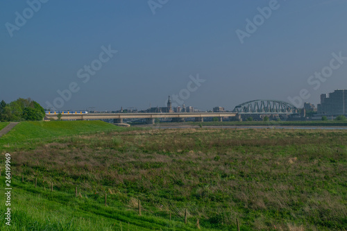 Dutch passenger train passing a bridge