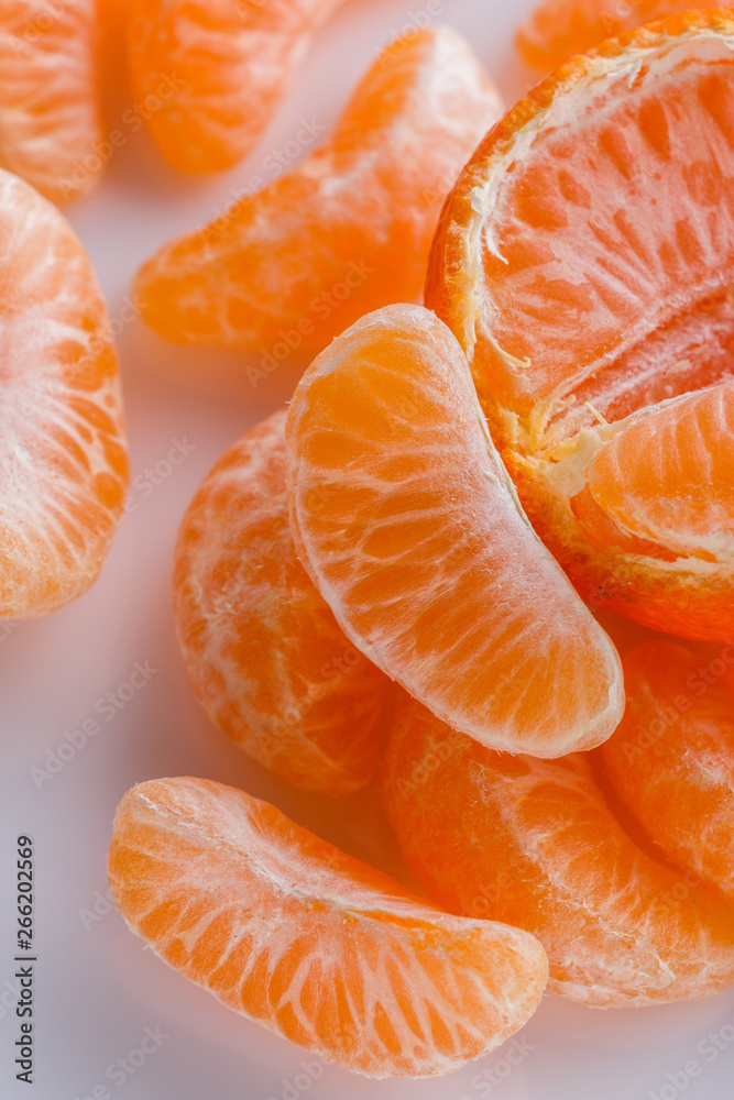juicy mandarin on a white acrylic background juicy mandarin on a white acrylic background