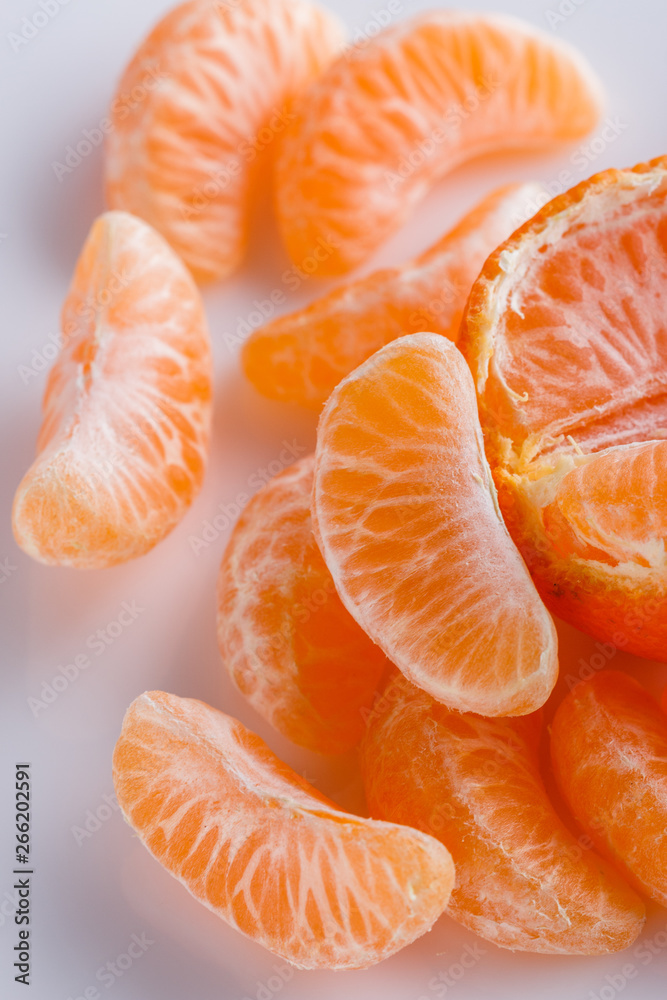juicy mandarin on a white acrylic background