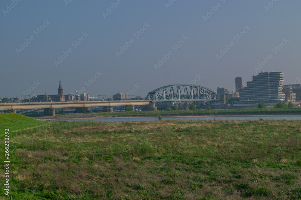 Dutch passenger train passing a bridge