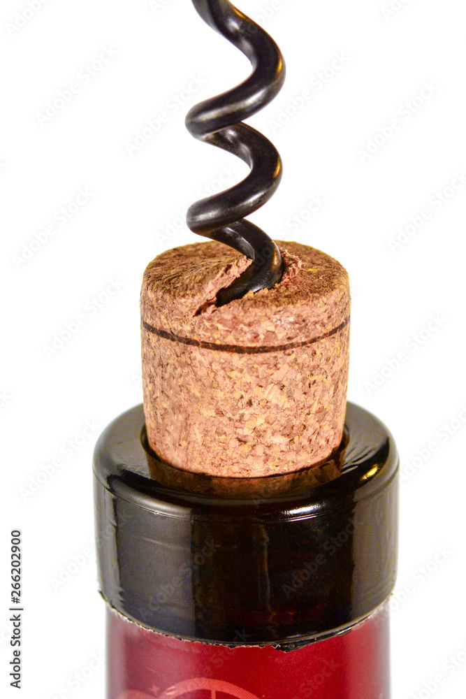 Corkscrew pulls out a cork from the bottle of red wine. Cork close up macro, isolated on white background. Corkscrew pulls out a cork from the bottle of red wine. Cork close up macro, isolated on white background.