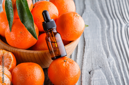 juicy mandarin on a gray wooden rustic background photo