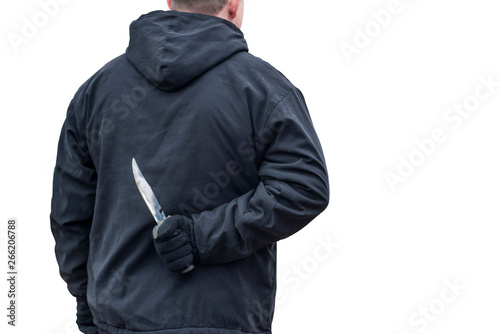 Man with the knife isolated on white background. Criminal with knife weapon hidden behind his back