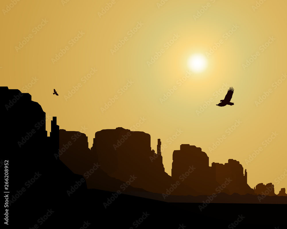Western desert. Rocks. Flying eagles. Yellow sky. Sunset .