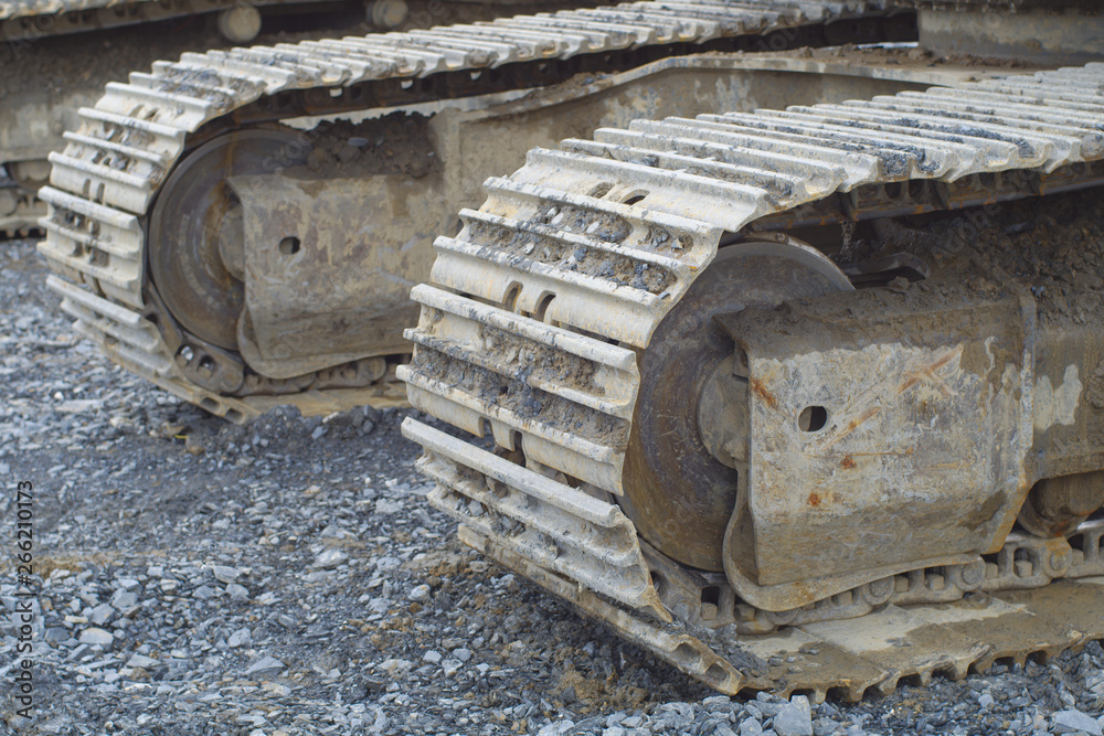 excavator bulldoser caterpillar closeup track construction site digger industry