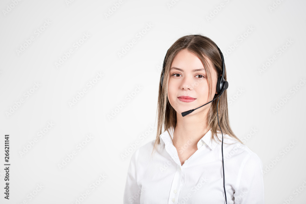 Female consulting manager with headset on light background. Female consulting manager with headset on light background.