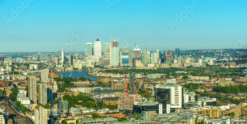 Panoramic view of office buildings in Canary Wharf at sunset
