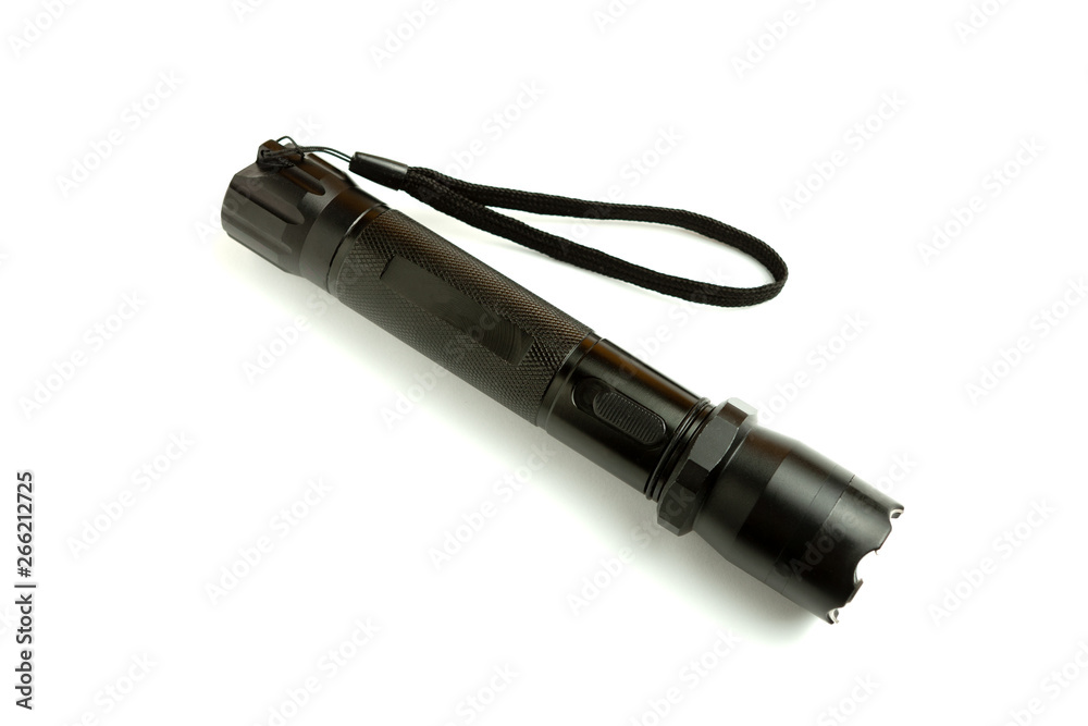A black metal flashlight with shocker at the white background. protection and security concept. for design and decoration. A black metal flashlight with shocker at the white background. protection and security concept. for design and decoration.