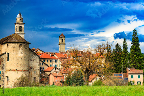 Old Italian Church in the Countryside of Italy in Sassello Liguria Region in Spring Season with Storm Coming Up and dark Sky photo