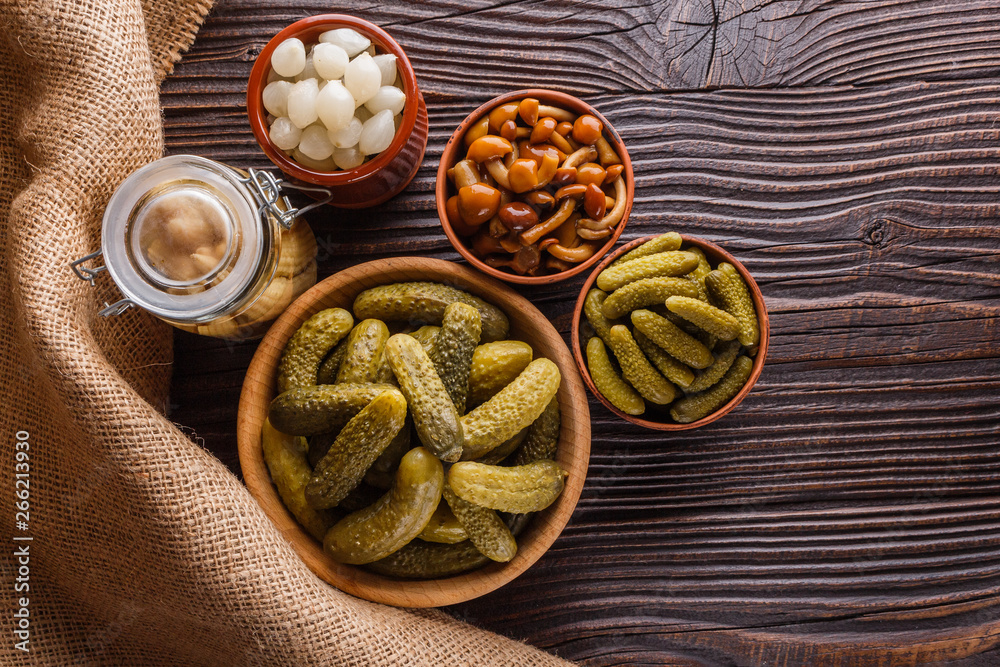 pickled vegetables on a wooden rustic background pickled vegetables on a wooden rustic background