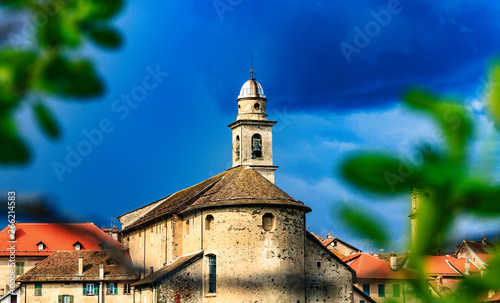 Old Italian Church in the Countryside of Italy in Sassello Liguria Region in Spring Season with Storm Coming Up and dark Sky photo