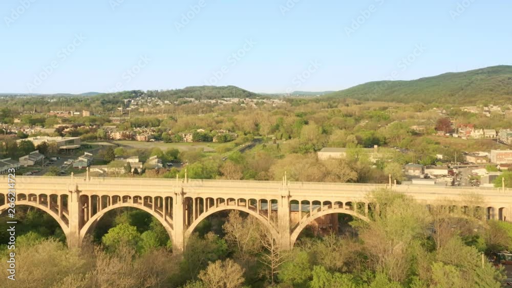 Drone shot of Allentown, Pennsylvania skyline and Albertus L. Meyers Bridge or 8th Street Bridge, on late sunny afternoon (with camera rotation). Allentown is Pennsylvania's third most populous city.