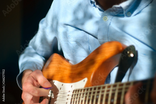 Guitar player strumming