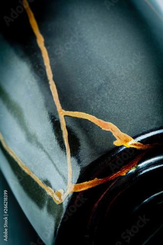 This is a vase I repaired using the Japanese art form of kintsugi with urushi lacquer and gold powder.
