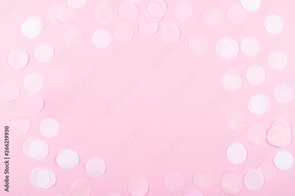 Pink background with confetti.