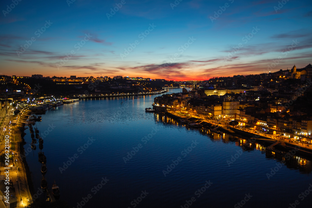 Views of the Douro river and Ribeira from Dom Luis I iron bridge in a magical twilight, Porto, Portugal.