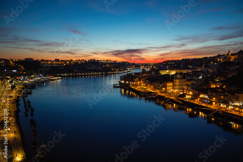 Views of the Douro river and Ribeira from Dom Luis I iron bridge in a magical twilight, Porto, Portugal. © De Visu