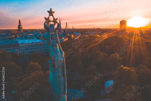 May 6, 2019. Riga, Latvia. Beautiful aerial view of the statue of liberty Milda in the center of the old town during live concert and sunset. photo