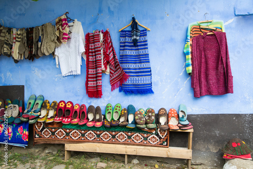 Traditional hand made woolen socks and booties for sale on the street of Viscri village in Transylvania