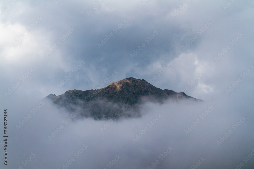 mountain peak in the clouds