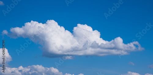 Texture of beautiful spring clouds on the background of blue clear sky