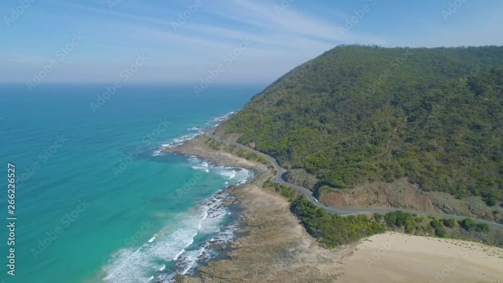 Forward flight towards Great Ocean Road winding along beautiful ocean coastline in Victoria, Australia Forward flight towards Great Ocean Road winding along beautiful ocean coastline in Victoria, Australia