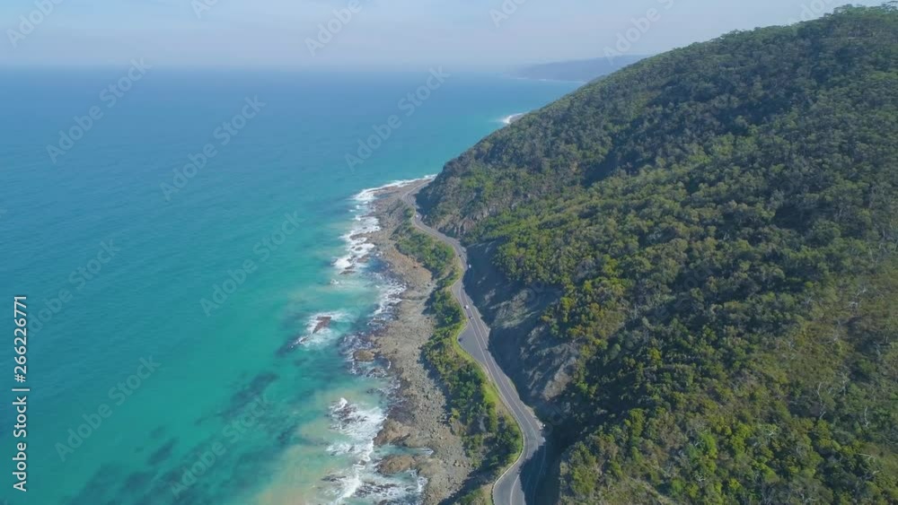 Drone flight along bends of the famous Great Ocean Road on rugged ocean coastline near Lorne, Victoria, Australia Drone flight along bends of the famous Great Ocean Road on rugged ocean coastline near Lorne, Victoria, Australia