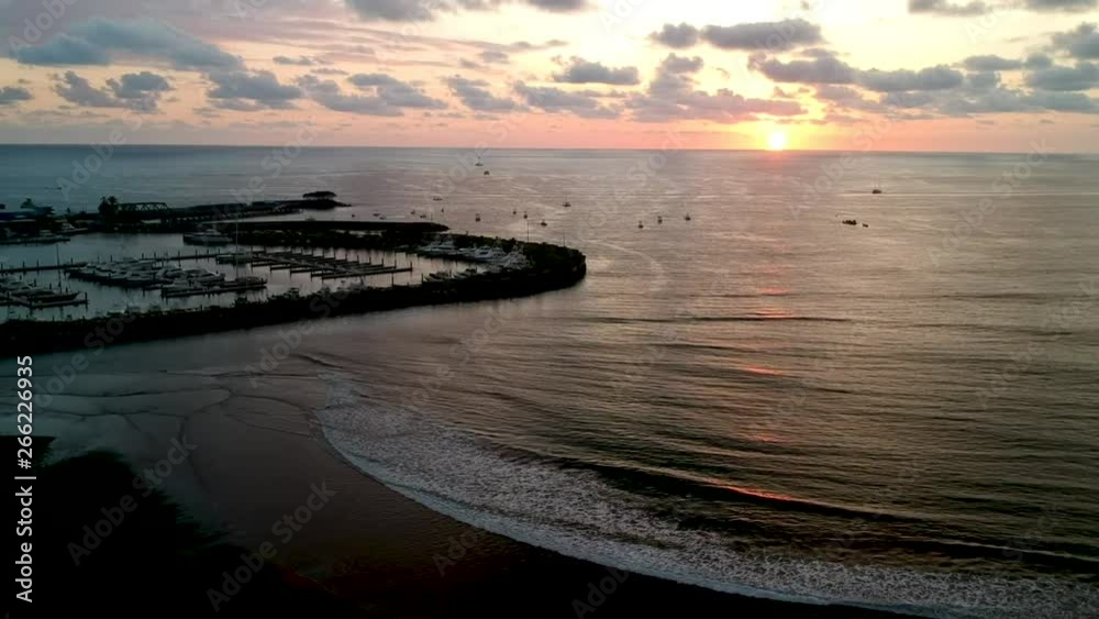 Aerial high angle dolly forward of spectacular sunset in Quepos port beach in Costa Rica. Aerial high angle dolly forward of spectacular sunset in Quepos port beach in Costa Rica.