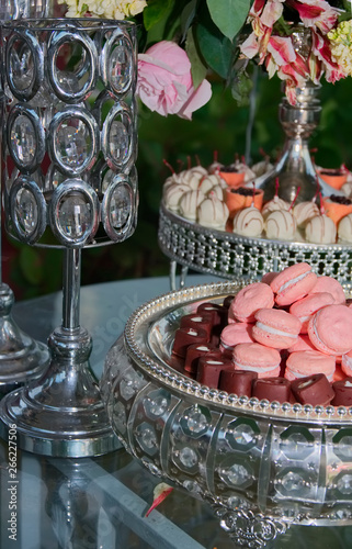 Close up of tray with lot delicious diversity pastry cakes tattlers and macaroon in a row
