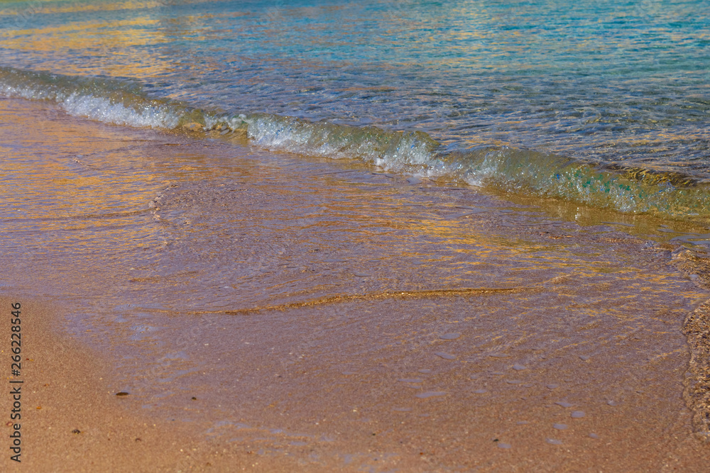 Closeup of the sand on beach and Red sea water Closeup of the sand on beach and Red sea water