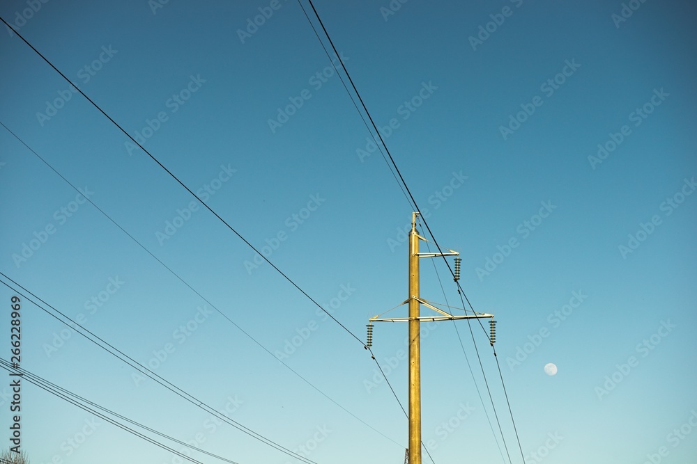 top old electrical pillar on a background of the blue sky top old electrical pillar on a background of the blue sky