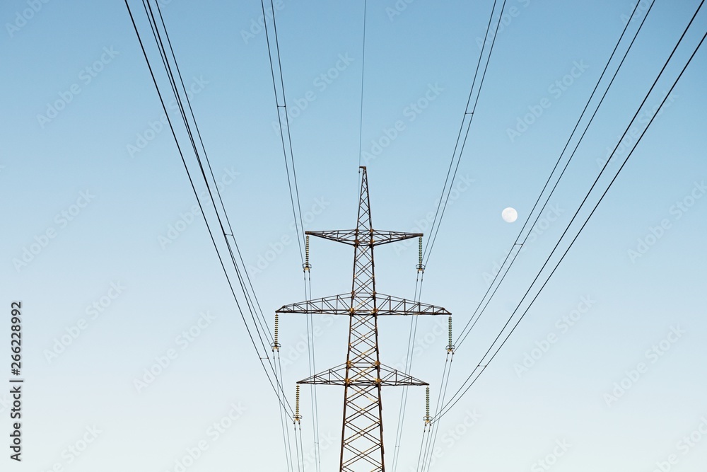 top old electrical pillar on a background of the blue sky top old electrical pillar on a background of the blue sky