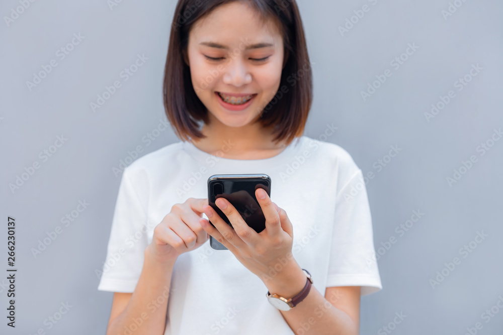 Woman using smartphone, During leisure time. The concept of using the phone is essential in everyday life. Woman using smartphone, During leisure time. The concept of using the phone is essential in everyday life.