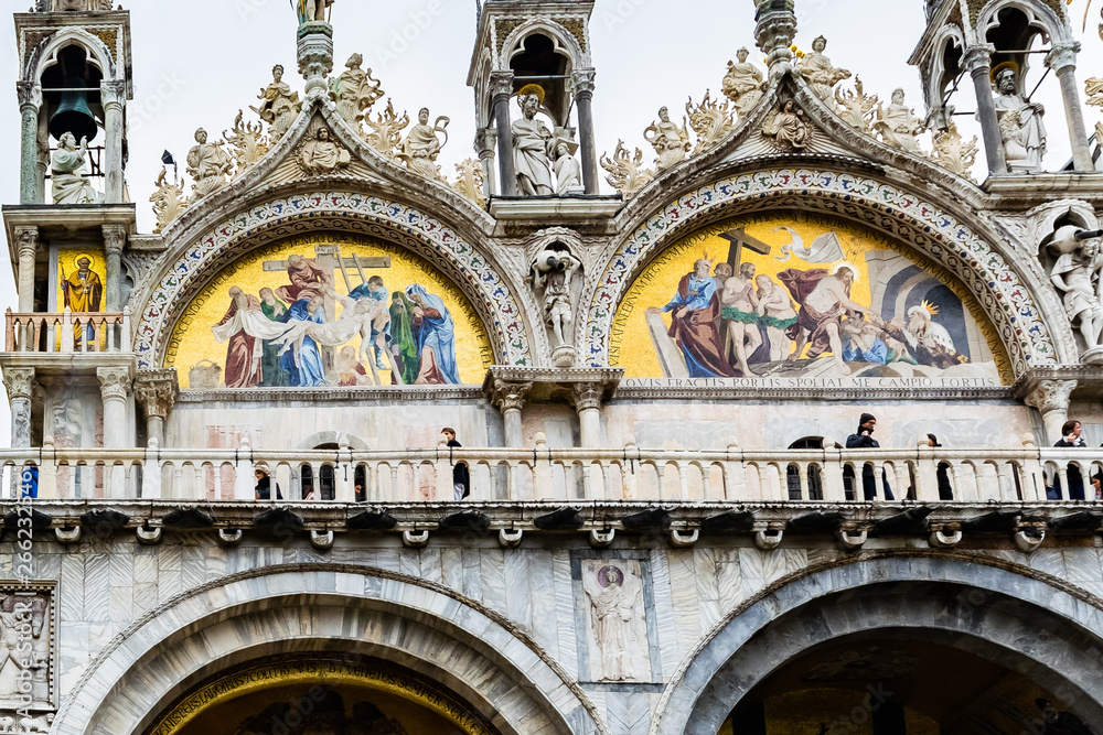 Exterior wall mosaic artwork on San Marco Basilica (Patriarchal Cathedral of Saint Mark) in Piazza San Marco (St Marks Square), Venice, Italy. Exterior wall mosaic artwork on San Marco Basilica (Patriarchal Cathedral of Saint Mark) in Piazza San Marco (St Marks Square), Venice, Italy.