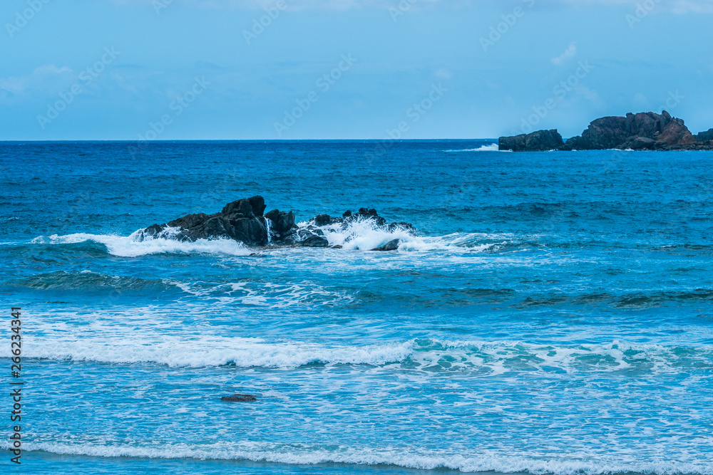 Ocean surf on the rocky beach