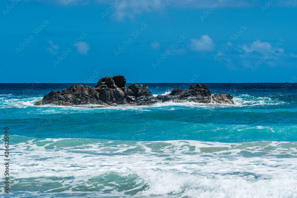 Ocean surf on the rocky beach