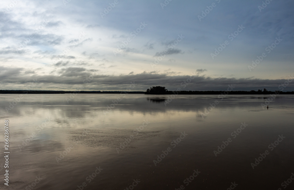 Storm clouds reflected in the waters of the river. Free space to write. Storm clouds reflected in the waters of the river. Free space to write.