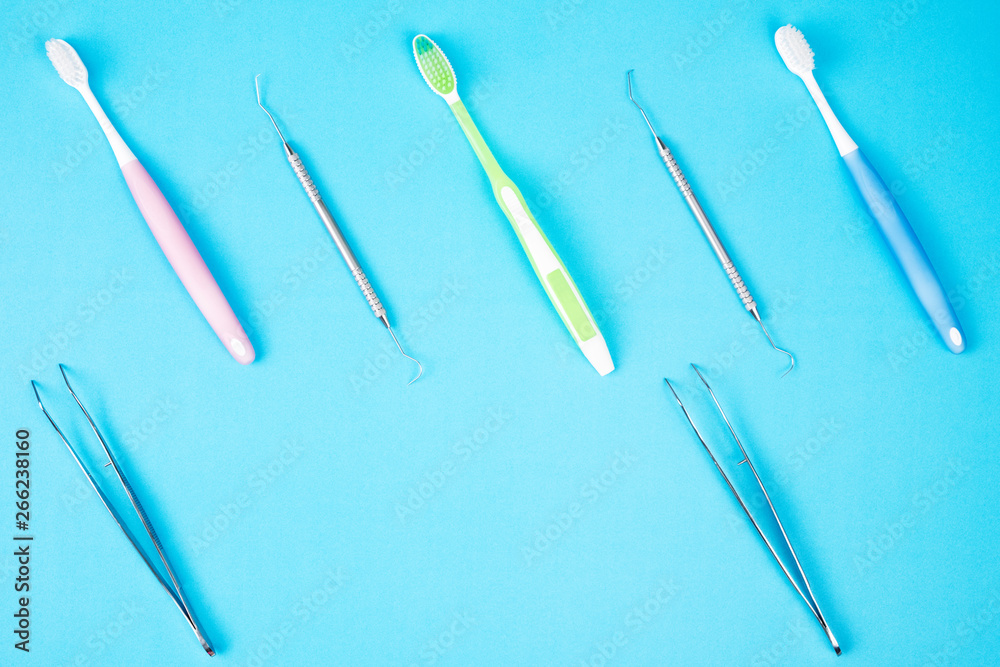 Dental tools use for dentist on the blue background, flat lay, top view. Dental tools use for dentist on the blue background, flat lay, top view.