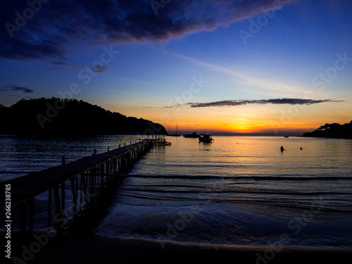 Wood bridge on the sea with a beautiful sunset at koh kood island  Thailand