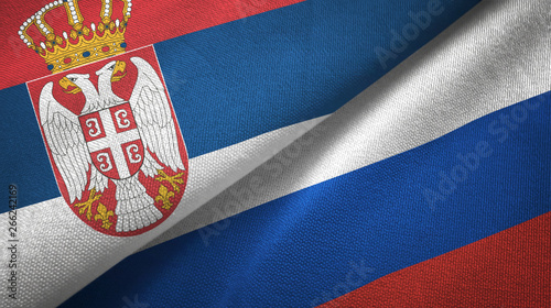 Serbia and Russia two flags textile cloth, fabric texture photo