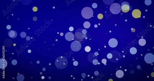 Golden confetti and bokeh lights on the blue Merry Christmas background.