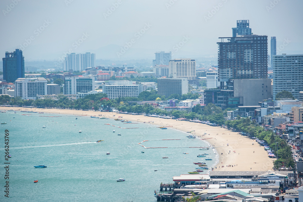 Naklejka premium Bay area with beach sea with ferry boat and tourist travel view landmark in the Pattaya city