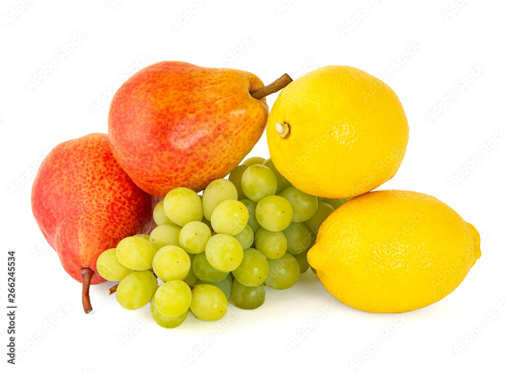 A pair of fragrant yellow lemons with a branch of ripe green grapes and bright scarlet delicious pears on a white background