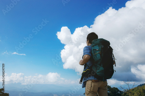 Male tourists and backpacks at sky.