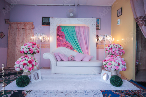 Bridal dais, wedding stage decoration built for the bride and groom on their wedding day. The couple will sit on the dais or pelamin photo